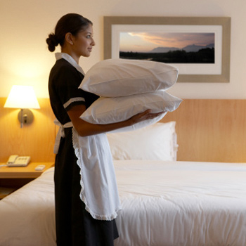 A maid making with some bed linen